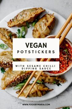 vegan potstickers with sesame chili dipping sauce on a white plate and chopsticks