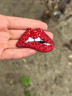 Handmade Red Lip Brooch, Crystal Lip Pin, Woman Brooch, Biting Lip Beaded Brooch,  Quirky Red Lips, Sparkly Beaded Brooch, Gift For Her red lips are awesome! This carefully crafted brooch can be a very nice gift. Made using quality stones. Crystal stones, Japanese beads, Italian sequins are used. the back side is covered with red artificial leather and steel unbreakable needle is used. Length: 1.37 inch (3cm) Width: 2.36 inch (6cm) Red Enamel Brooch Pin For Gift, Unique Rhinestone Brooch For Gift, Red Brooch Pins For Valentine's Day, Red Rhinestone Brooches For Gifts, Red Rhinestone Brooch For Gift, Red Beaded Brooch For Party, Handmade Red Brooches As Gift, Unique Handmade Red Brooches, Biting Lip