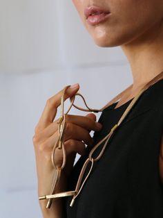 Our leather chine hoops necklace showcases an elegant design that is achieved by subtle design elements and materials. The necklace features a various arrangement of hoops that is laced with a metal wrap around on the edge. Creating a charming piece of jewelry that you will look absolutely stunning in. moreover, the simple yet charming design is brought to life using premium grade leather, that offers the perfect amount of appeal and charm one could ask for. Allowing you the chance to wear a min Oversized Necklace, Long Necklace Gold, Hipster Purse, Necklace Leather, Modern Necklaces, Necklace Statement, Leather Gifts, Necklace Long, Everyday Earrings