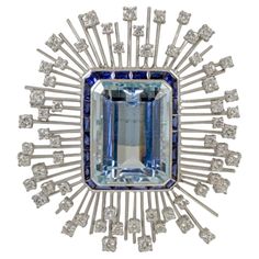 This brooch is designed with aquamarine stone in the center with the total carat weight of 35.03 accented with sapphire with the carat weight of 3.70 and diamonds with the total carat weight of 3.55. Sophia D by Joseph Dardashti LTD has been known worldwide for 35 years and are inspired by classic Art Deco design that merges with modern manufacturing techniques. Blue Diamond Gemstone Brooches, Blue Diamond Brooches For Anniversary, Diamond Gemstone Brooches In Art Deco Style, Art Deco Diamond Brooches With Gemstone, Fine Jewelry Blue Brooches For Anniversary, Blue Fine Jewelry Brooches For Anniversary, Blue Gemstone Brooch For Anniversary, Blue Gemstone Brooches For Anniversary, Blue Art Deco Formal Brooch