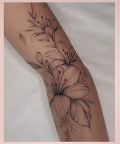 a woman's arm with flowers on it