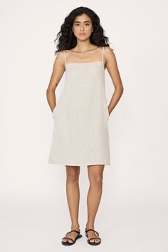 Elevate your style with our mini dress—a chic and versatile piece that features a square neckline, adjustable straps for the perfect fit, and a vent at the back for ease of movement. Completing the look is a practical side zip, ensuring both style and convenience for any occasion. Made with organic linenLined with organic cottonHandmade in IndiaMachine wash cold on delicate cycle, lay flat to dry, warm iron as needed Honoring Earth + Maker Each of our wovens are handcrafted in India, preserving Fitted Slip Dress With Tie Straps And Straight Neckline, Straight Neckline Dress With Straps For Day Out, Chic Linen Mini Dress With Square Neck, Chic Linen Mini Dress With Spaghetti Straps, Chic Square Neck Sundress With Straps, Fitted Sundress With Adjustable Straps And Straight Neckline, Straight Neckline Sundress With Adjustable Straps, Chic Mini Dress With Straight Neckline And Straps, Day Out Dress With Adjustable Straps And Straight Neckline