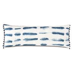 a blue and white pillow on a white background