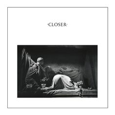 a black and white photo of a woman laying on a bed with the words closer above it