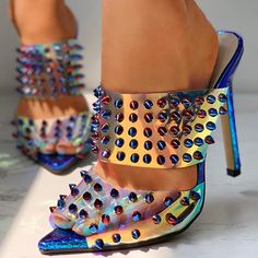 Step into the future with these Women's Holographic Pointed Toe Studded Decor Heeled Mules. Their trendy design combines holographic shine, pointed-toe elegance, and edgy stud embellishments for a fashion-forward look. Color: Multicolor Material: PVC Heel Type: Stiletto heel Heel height: 4.72" / 120 mm approx Product measurements were taken using size 8. Please note that measurements may vary by size. Toe: Pointed toe Rivet embellishment Handcrafted US sizing. Fits true to size. Summer Pointed Toe Heels With Spikes, Summer Spiked Pointed Toe Heels, Pointed Heels For Party, Pointed Toe Synthetic Heels For Party Season, Synthetic Pointed Toe Heels For Party Season, Iridescent Heels For Spring, Spring Party Pointed Heels, Multicolor Pointed Toe Heels For Party, Iridescent Open Toe Heels For Party