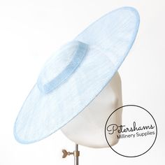 This light blue cartwheel hat base is a classic shape that has sprung into popularity in the past year. Made from 2 layers of stiffened sinamay, these cartwheels are ready to trim and are fitted with a petersham ribbon on the inside crown edge. Simply add a comb or headband to secure to the head. *This is not a fitted hat! You will need to sew in a headband or comb to attach it to your head* Hat base measures: Width: 35.5cm (14 inches) Crown Width: 13.5cm (5.3 inches) Crown Height: Approximately Cartwheel Hat, Sinamay Fascinator, Millinery Supplies, Hat Base, Fancy Lights, Fascinator Hat, Millinery Hats, Sew In, Fascinator Hats