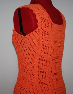 an orange top with crochet on it