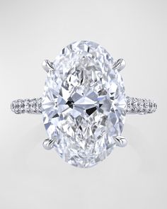 an oval cut diamond with pave set shoulders