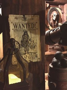 there is a sign that says wanted sparrowrow on the wall next to other items