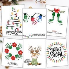 four christmas cards with hand prints on them