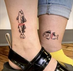 two people with matching tattoos on their feet, one has a fish and the other has a fish