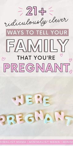 the words family that you're pregnant are written in pink and blue on white paper