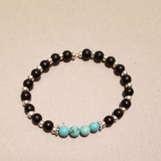 Unisex Beaded Bracelets. Made With Turquoise, Black Beads, And Silver Tone Spacers. Casual Turquoise Spacer Beads, Turquoise Beaded Bracelets With Black Beads As Gift, Casual Turquoise Beaded Bracelets With Spacer Beads, Turquoise Beaded Bracelets With Black Beads, Beaded Memory Wire Bracelets, Lava Bead Bracelet, Beaded Memory Wire, Memorial Bracelet, Beaded Cuff Bracelet