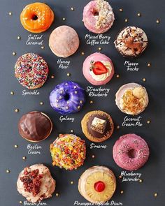 a black table topped with lots of different donuts