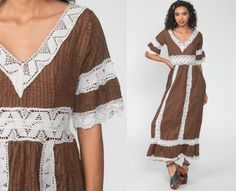 "Vintage 70s Mexican wedding dress in brown with crochet lace trim and an empire waist. It has bell sleeves, an empire waist & maxi length skirt. Zips up in the back. Every garment we sell is authentic vintage and one-of-a-kind! You will receive the exact item photographed. Condition: Very good vintage. Best fits women's: Extra small Tag: none Material: Feels like Cotton/poly MEASUREMENTS Taken from seam to seam while the garment is lying flat. Double the armpit, waist, and hips For referenc Bohemian Dresses With Contrast Lace, Pink Floral Sundress, Bohemian 70s, Wedding Crochet, Mexican Wedding Dress, Crochet Wedding, Mode Boho, 1980s Dresses, Crochet Lace Trim