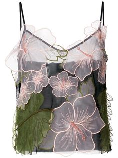 a top with flowers and leaves on it