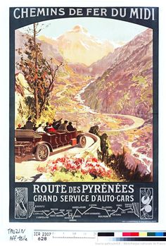 an old car driving down a road with mountains in the background and flowers growing on the side