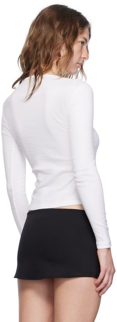 Cotton jersey T-shirt. Rib knit crewneck. Supplier color: White Ribbed Crew Neck T-shirt For Layering, Sporty Crew Neck T-shirt For Layering, Sporty Fitted Top With Ribbed Neckline, Sporty Fitted Crew Neck Sweater, Casual White Turtleneck T-shirt, Cotton Crew Neck Top With Ribbed Cuffs, White Fitted Top With Ribbed Cuffs, Sporty Tops With Ribbed Neckline And Stretch Fit, Cotton Tops With Ribbed Crew Neck