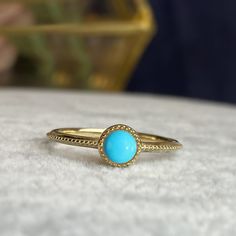 A mesmerizing blue that you can not resist! Handcrafted in 14K solid gold, this ring features 4mm round cabochon cut natural Arizona mined Sleeping Beauty Turquoise bezel set in a beautiful milgrain vintage style setting. Made to Order. Ships within 3-4 weeks. - Stone info: 4mm round cabochon sleeping beauty turquoise - Band width: 1.5mm - Made in 14 karat gold. - Stamp with 14K. Gold Turquoise Ring, Chloe Ring, Turquoise Gold Ring, Sleeping Beauty Turquoise, Piercing Jewelry, Turquoise Stone, Turquoise Ring, Solid Gold, Sleeping Beauty