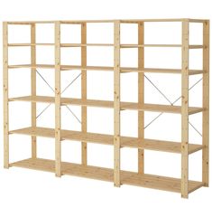 a wooden shelving unit with four shelves on one side and three rows on the other