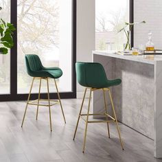 two gray and gold bar stools in a kitchen