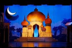 the stage is set up for a show with an image of a mosque on it