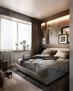 a bedroom with a large bed in front of a window next to a wooden floor