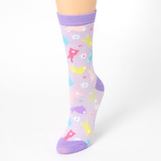 For hoppin' down the bunny trail, these colorful socks are just what your feet need! They're decorated all over with Easter bunnies and spring flowers in assorted pastel colors. A ribbed band at the top keeps them in from flopping down like a bunny's ears. Pack Size: One pair Stretch fit Approximate youth shoe sizes: 1-5 (US); 13-4 (UK); 32-37 (EU) Material: Acrylic - Claire's Easter Bunny Purple Crew Socks Pink Socks For Spring, Fun Multicolor Socks For Spring, Cute Non-slip Socks For Spring, Cute Pink Spring Socks, Easter Socks, Pastel Socks, Fun Multicolor Spring Socks, Comfortable Purple Cotton Socks, Youth Shoes