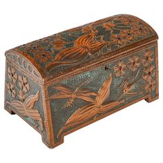 an ornate wooden box with birds and flowers painted on it