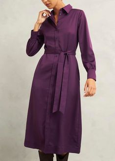 a woman in a purple shirt dress