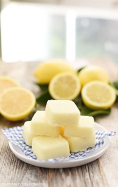 sliced lemons on a plate with one cut in half