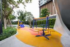 children's play area with swings and slides