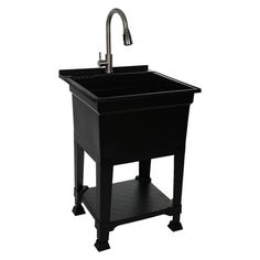 a black sink sitting under a faucet next to a metal faucet