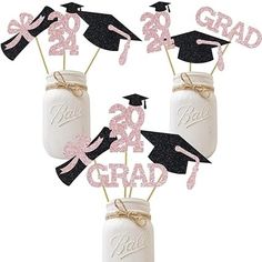 graduation decorations in mason jars with pink glitter