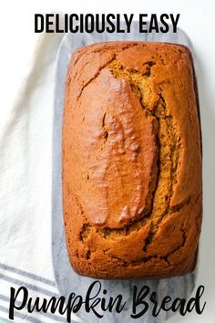 a loaf of pumpkin bread sitting on top of a towel