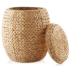 a large woven basket next to a smaller round container on a white background with reflection