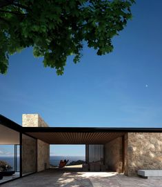 an outdoor area with concrete walls and stone steps leading up to the house's entrance