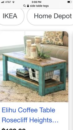 a living room with a couch, coffee table and rug on the floor in front of it