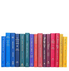 a row of books sitting on top of each other in front of a white background