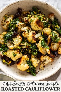 roasted cauliflower with herbs in a white bowl