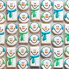 decorated cookies with snowmen on them are arranged in the shape of square faces and squares