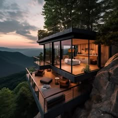 a house on top of a cliff with a view