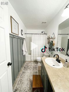 a bathroom with a sink, toilet and shower in it's own home area