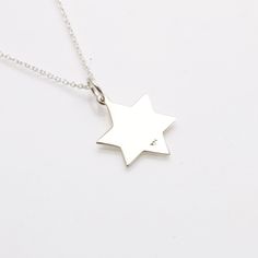 This elegant necklace is made of 925 Sterling Silver. Its a solid and smooth Jewish Star of David pendant. It has a flat surface that is perfect for engraving and is beloved by people of all ages. Great for a man or a woman and comes on a cable chain. Length (including bail): 15/16" Width: 5/8" Available in 16" or 18" Larger Star and matching bracelet available! Red Leather Bracelet, Star Of David Necklace, Jewish Star, Hamsa Charm, Hamsa Pendant, Star Of David Pendant, Elegant Necklace, Tree Of Life Pendant, Matching Bracelet