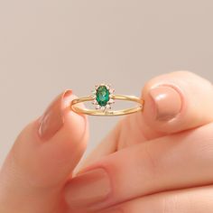 14k 18k 10k Real Solid Gold Minimalist Tiny Oval Cut Emerald Halo Promise & Floral Engagement Ring for Women with Yellow Rose White Gold Options. This Deep Green Small Gemstone Ring is the excellent anniversary gift for wife. Perfect minimal jewelry for everyday use and to complete your each look with a simple touch by Norm Jewels. Ring Details ❥ Gold KT: 14k 18k 10k Solid Gold ❥ Gold Color Options: Yellow Gold, White Gold, Rose Gold ❥ Band Width: 1.36 mm ❥ Ring Width: 7.69x5.85 mm ❥ Thickness: 14k Gold Rings With Halo Design For May Birthstone, Yellow Gold Rings With Halo Design For May Birthstone, Yellow Gold Halo Design Ring For May Birthstone, Emerald Ring With Halo Design In 14k Gold, Dainty Yellow Gold Emerald Open Ring, Dainty 14k Gold Halo Ring, Dainty 14k Gold Cluster Ring With Halo Setting, 14k Gold Emerald Ring With Halo Design For Promise, 14k Gold Emerald Ring With Halo Design