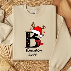 Christmas Alphabet Shirt, Personalized Christmas Family Tshirt, Christmasmas Holiday Sweatshirt, Monogrammed Family Christmas, Santa Clasus 𝗛𝗢𝗪 𝗧𝗢 𝗢𝗥𝗗𝗘𝗥? 𝟏. Select the shirt 𝗦𝘁𝘆𝗹𝗲 2. Select the 𝗦𝗶𝘇𝗲 3. Select the shirt color 4. Select the quantity, 5. Click 𝗔𝗗𝗗 𝗧𝗢 𝗖𝗔𝗥𝗧. If you want to buy more than one, please go back to the listing and repeat the steps. We choose Gildan Soft Style (100% Cotton), Bella Canvas (100% Cotton), Sweatshirts and Hoodies Gildan (50% Cotton-50% Polyester) and other brands . Please let us know if you want a specific brand. Otherwise we will send the brand available in our stocks. -> The lettering on the t-shirts is black in light colors and white in dark colors. If you want a specific color, please send us a message. -> If you need to o Christmas Letter Print Crew Neck T-shirt, Christmas Crew Neck T-shirt With Letter Print, Family Holiday T-shirt With Letter Print, Family Matching Christmas T-shirt With Letter Print, Christmas Custom Print Cotton T-shirt, Christmas Alphabet, Holiday Sweatshirt, Custom Christmas, Family Christmas