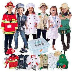 children dressed up in costumes standing next to an open box with clothes on it and other items around them