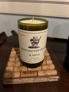 a bottle of wine sitting on top of a cork coaster