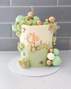 a cake decorated with green and gold decorations