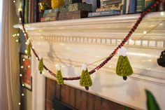 there is a christmas garland hanging on the mantle